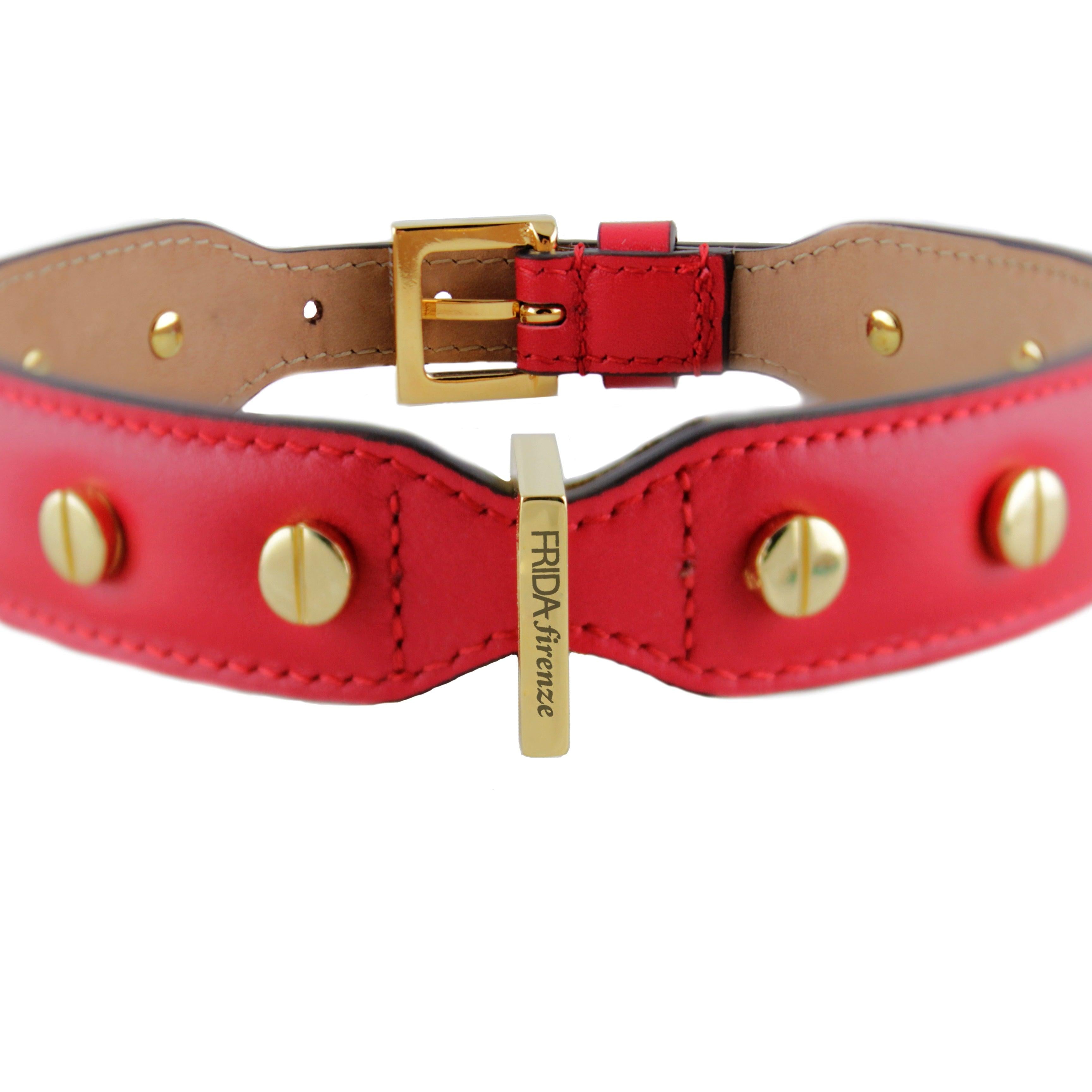 Red leather stud collar with gold rivets and buckle; vertical gold tag engraved FRIDA Firenze.