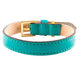 Turquoise leather collar with beige interior, antique-style gold buckle and stitched edges.